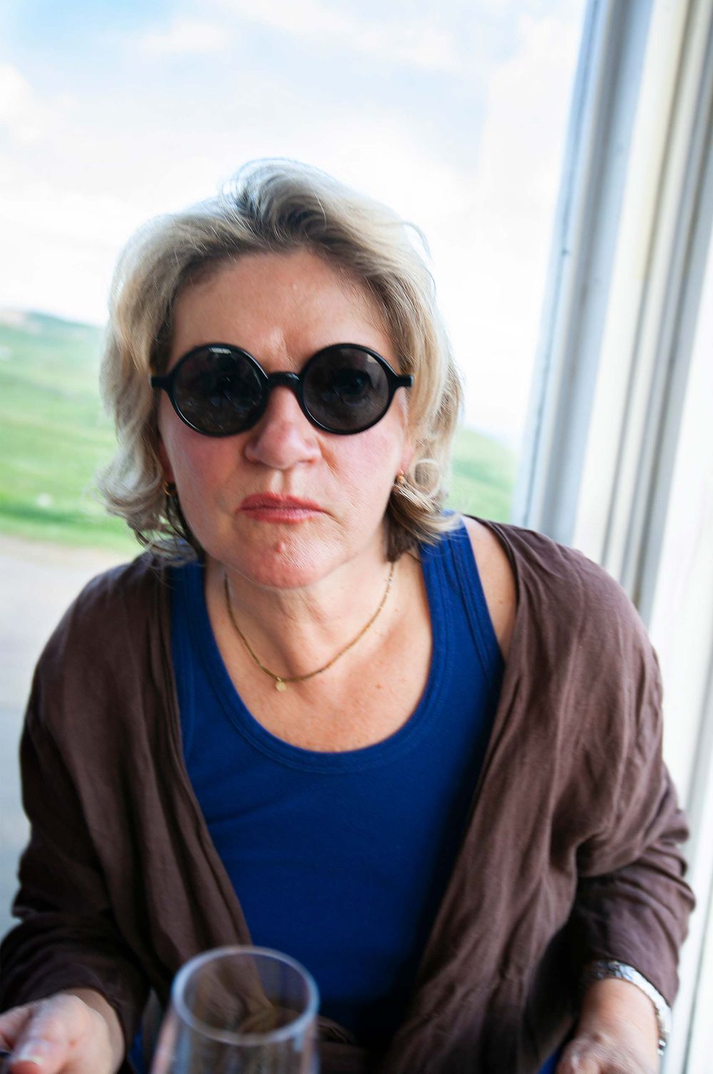 woman at bar with designer sun glasses portrait Quebec Canada