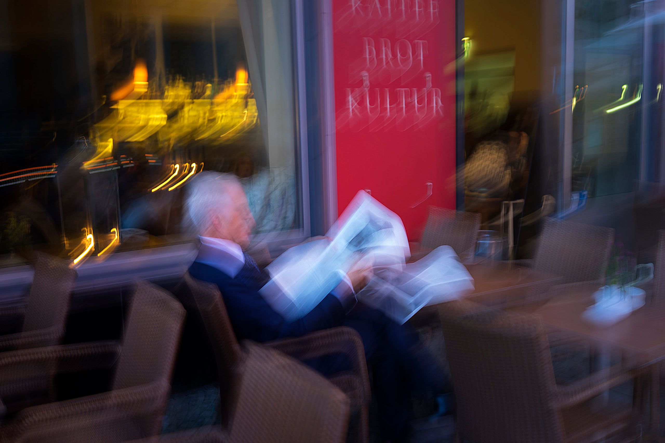 Man reading news paper in Berlin Germany 