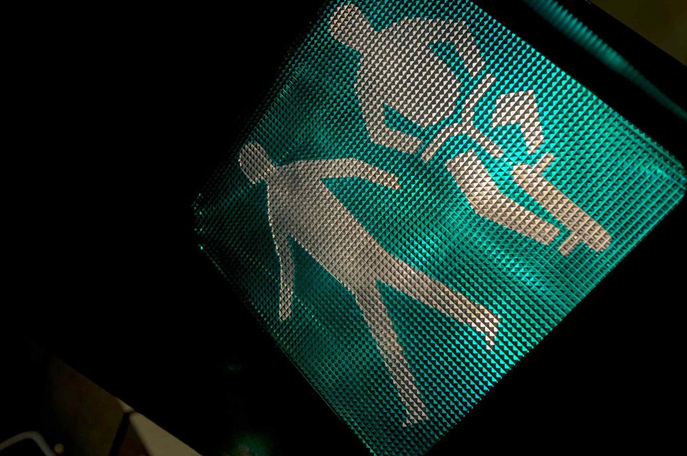 Close up of pedestrian and pedestrian crossing sign icons