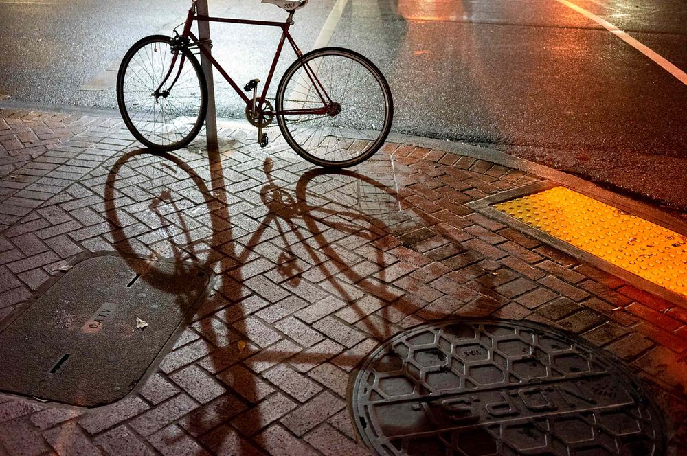 Bike on pole at night in new orleans  gravier and  Tchoupitoulas Street