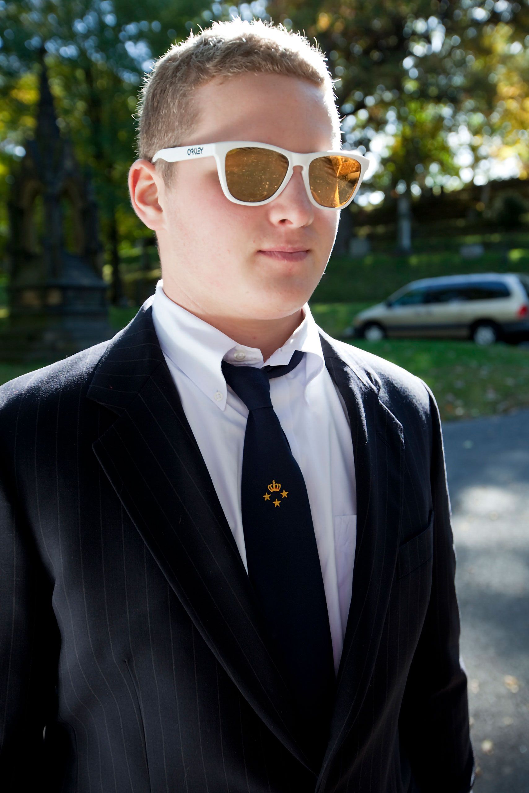 Jack Roos dude in a coat and tie cool Oakley sunglasses a