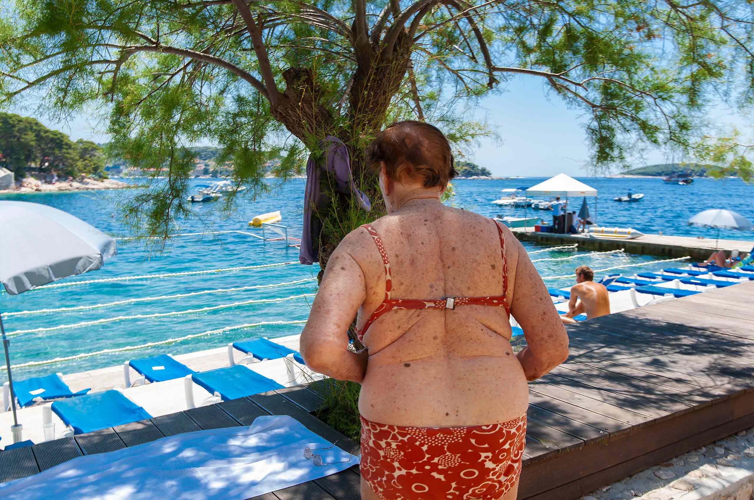 elderly woman in bikini in Croatia 