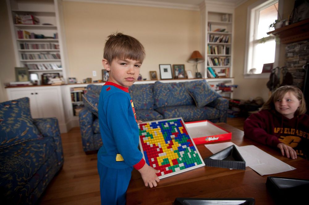 Young superman pajamas and game portrait 