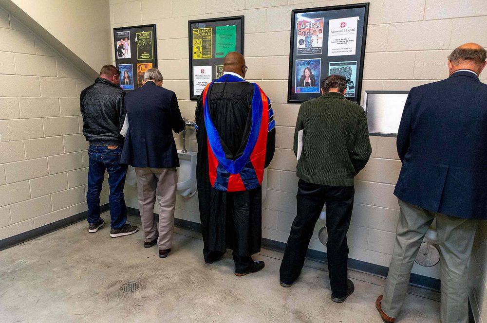 Peeing after graduation in ice rink bathroom in Colorado springs