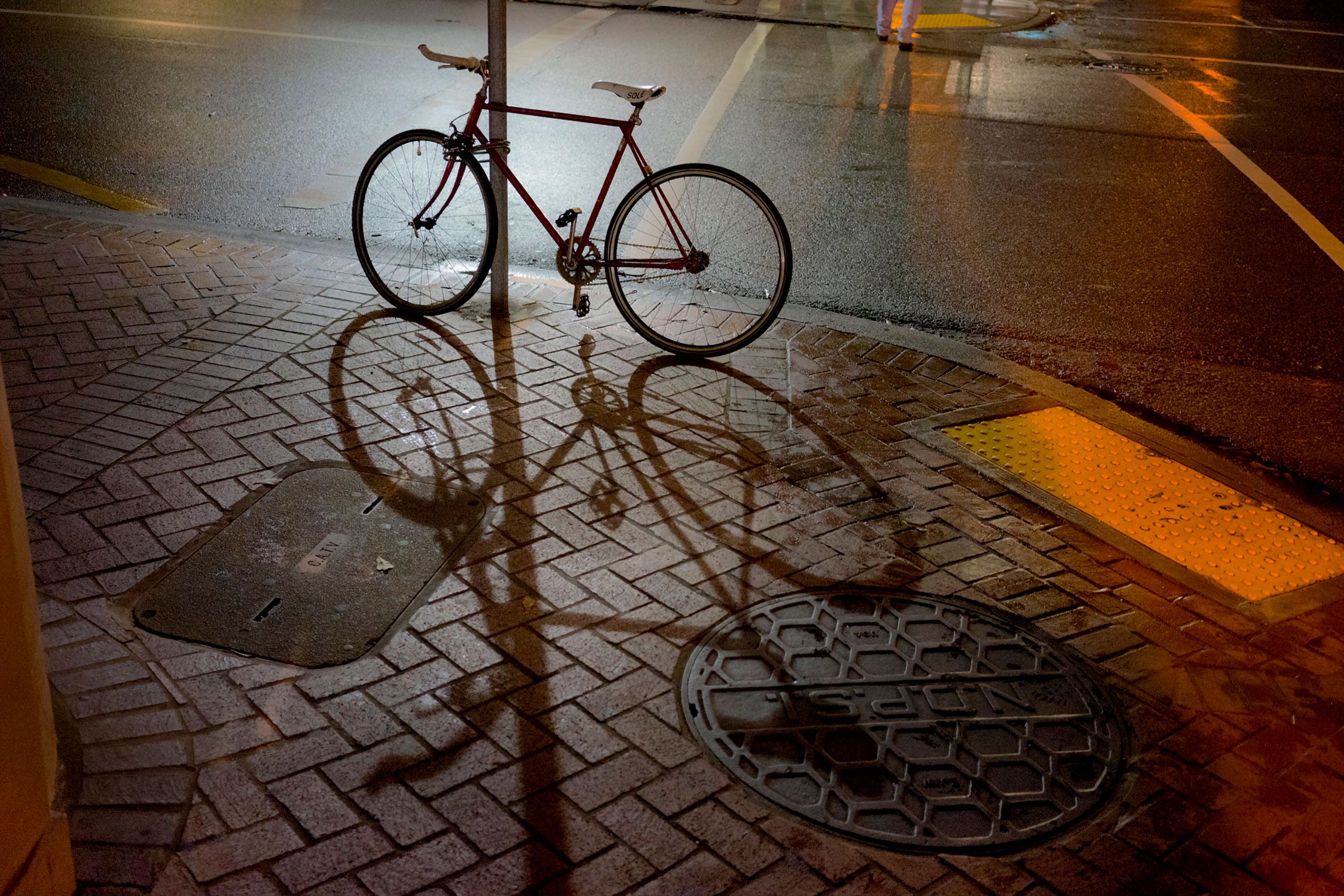 Bike in night New Orleans Louisiana NOLA chatropolis street by Resuruant august