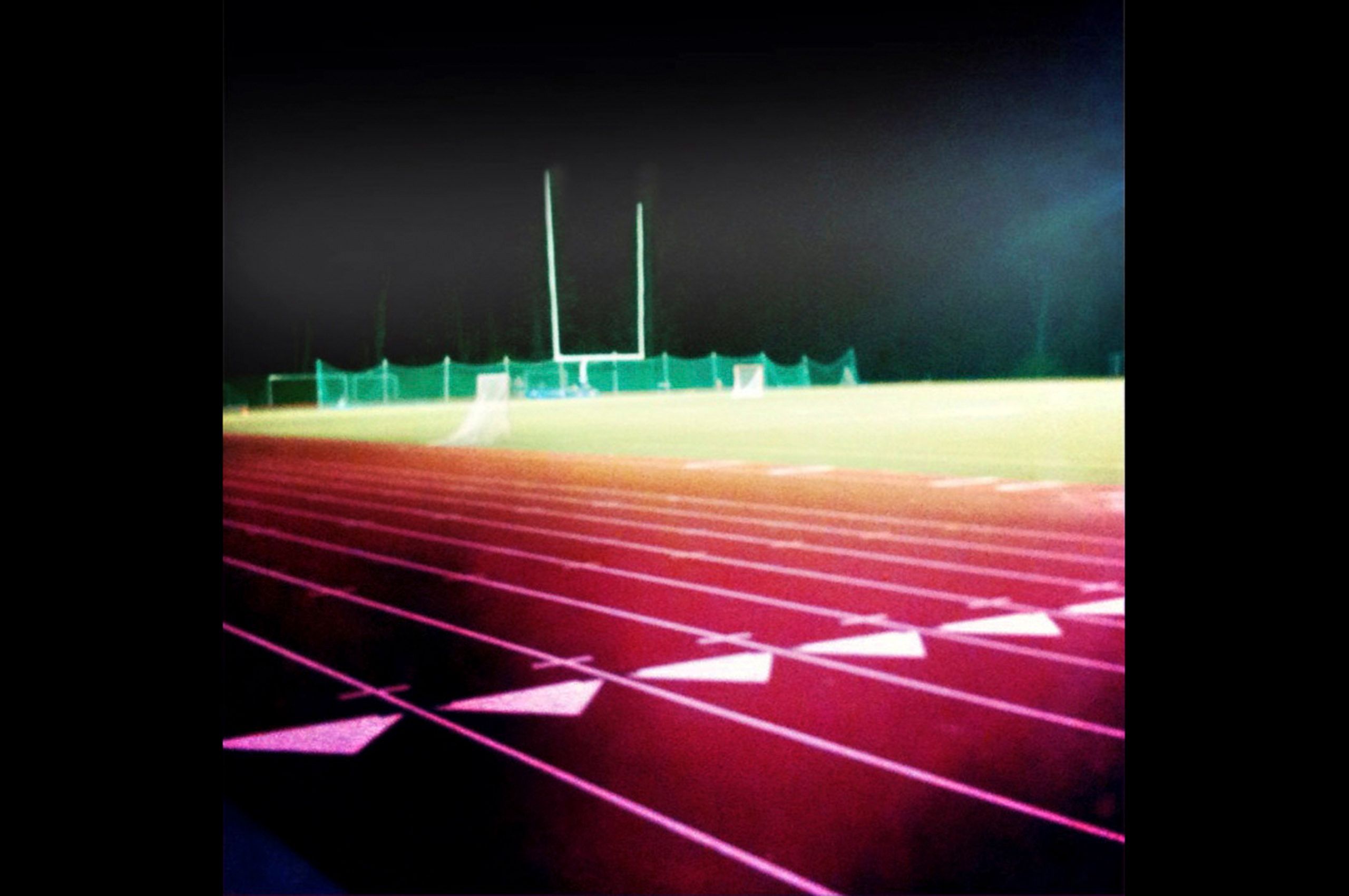 Football goal post Yarmouth Maine High School track late at night