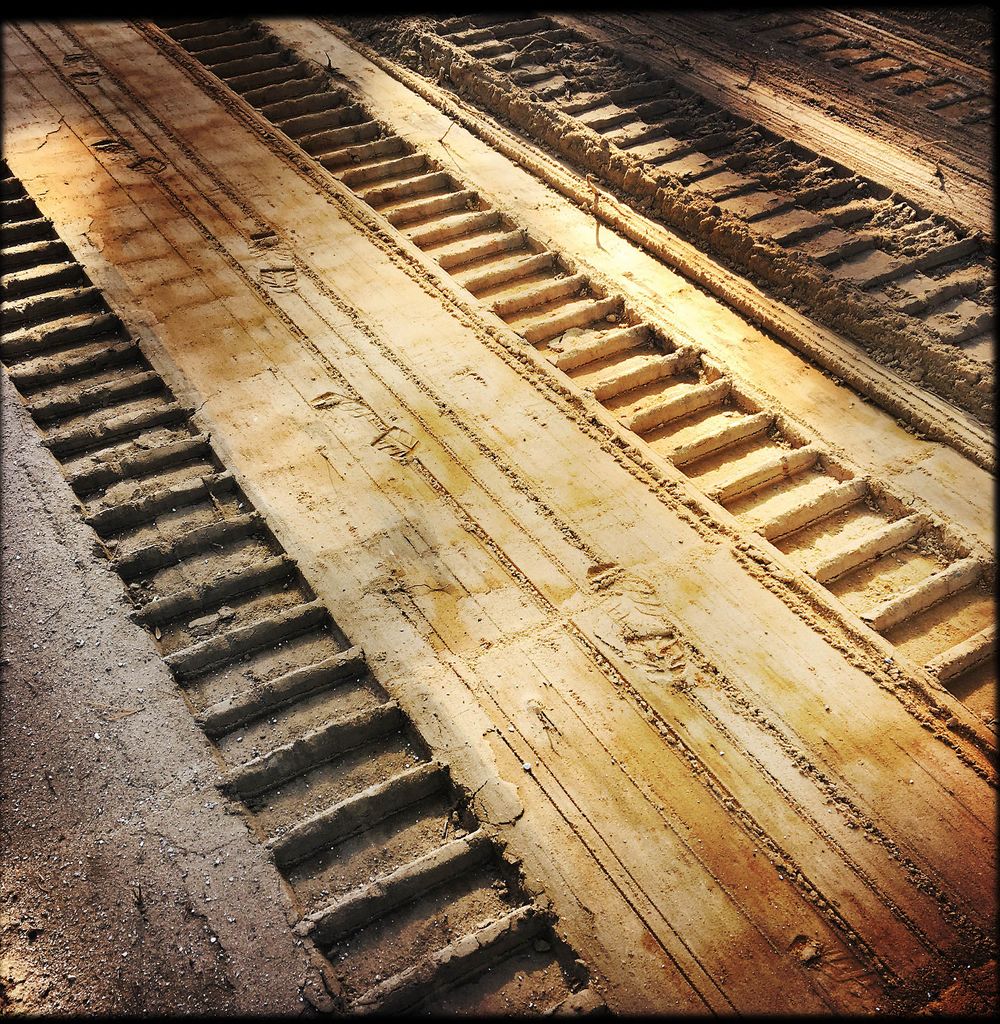 Caterpillar track in the sand in Grafton Beach Florida 