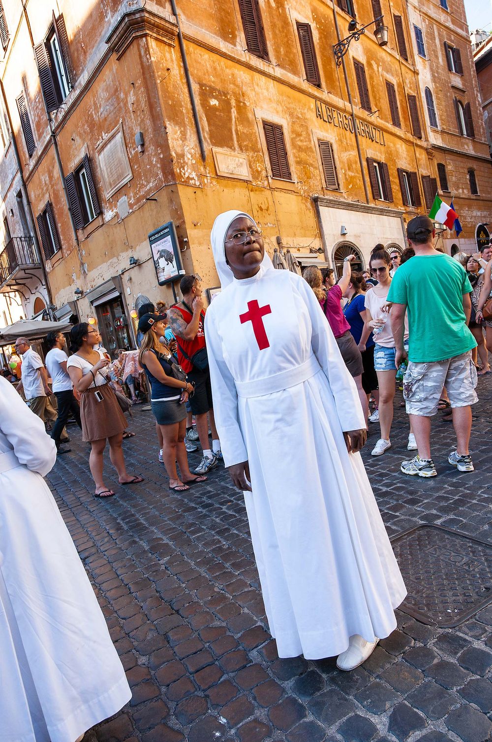 A nun in Rome Italy red cross