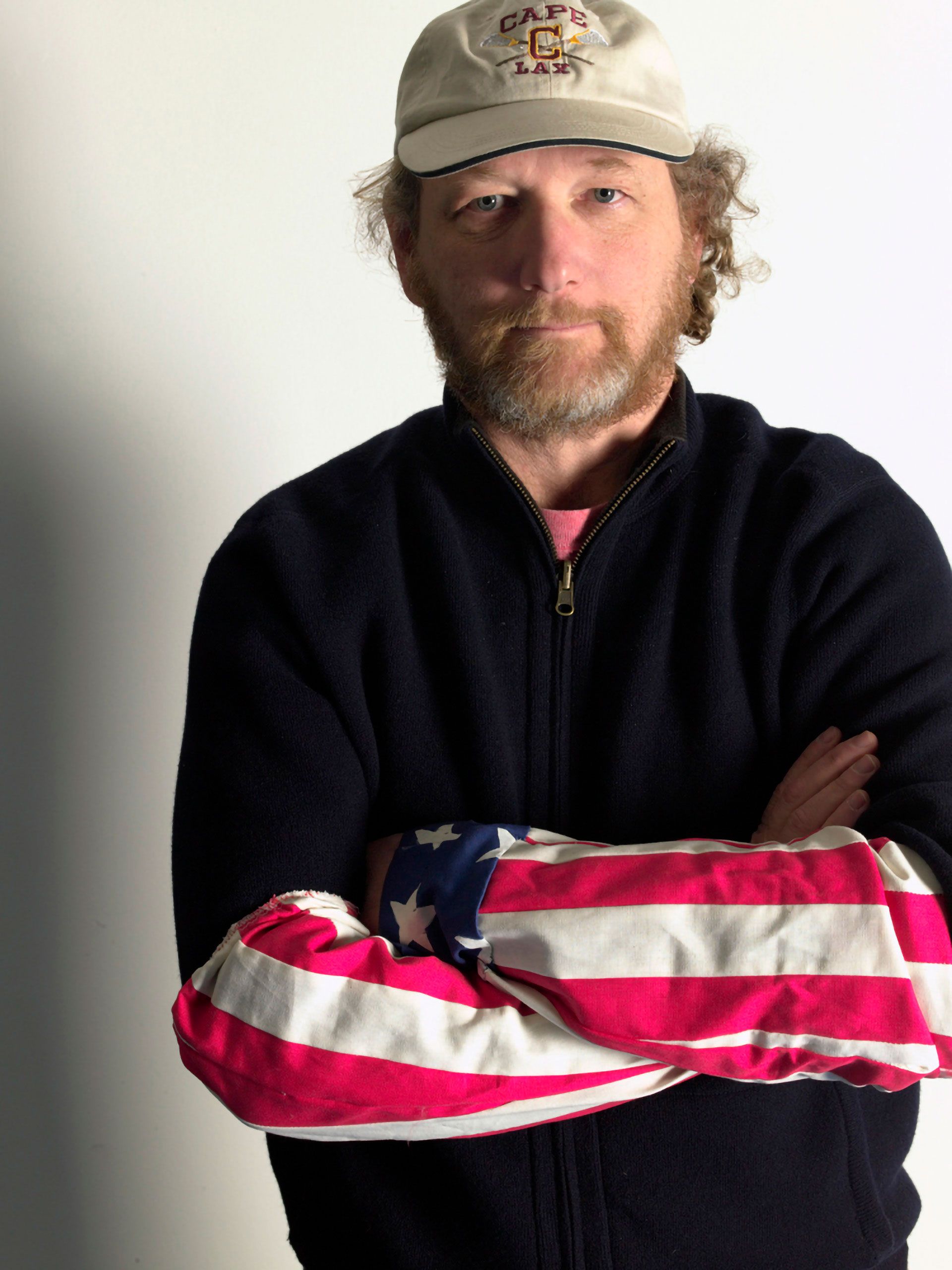 Warren Roos wasting his flag sleeves and caper lelizabeth lacrosse hat