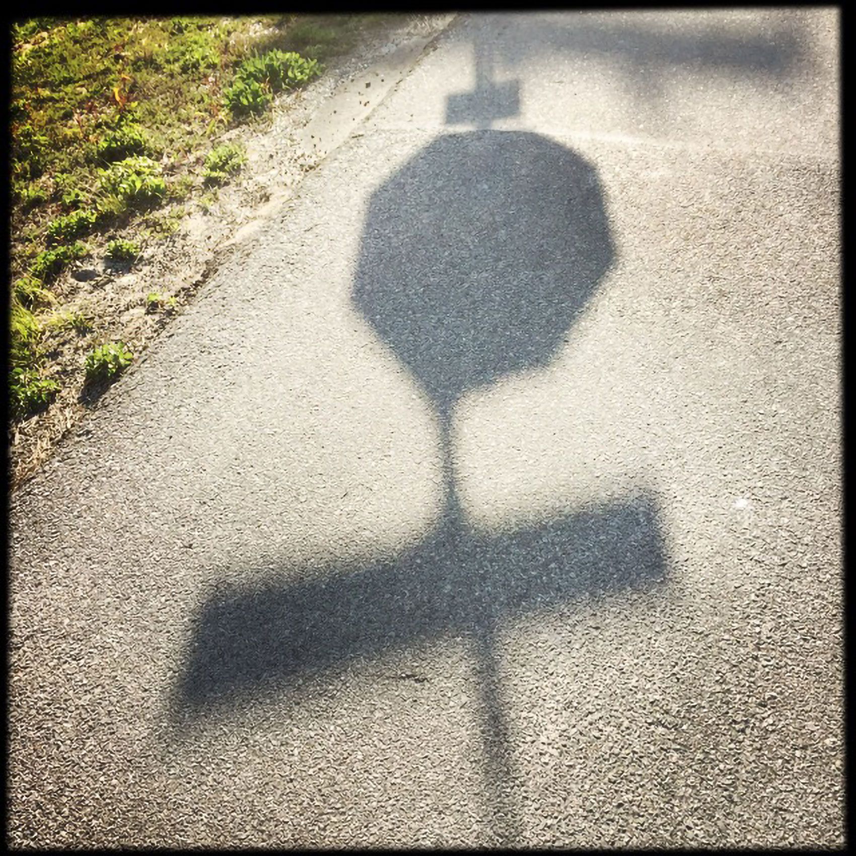 Stop sign shadow Santa Rosa Beach Flordia 