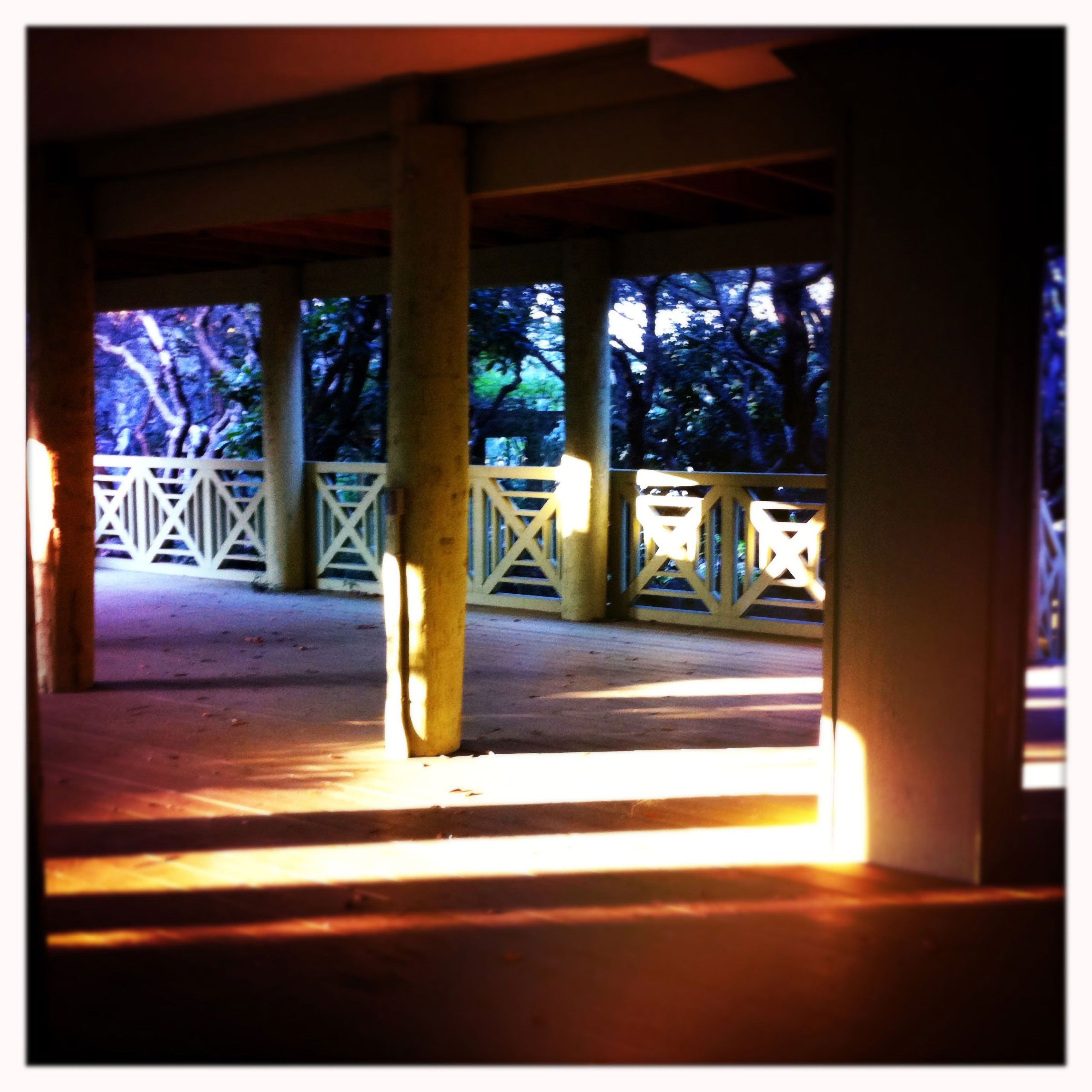 Sunset Under the house fence and posts Santa Rosa Beach Florida Blue mountain beach