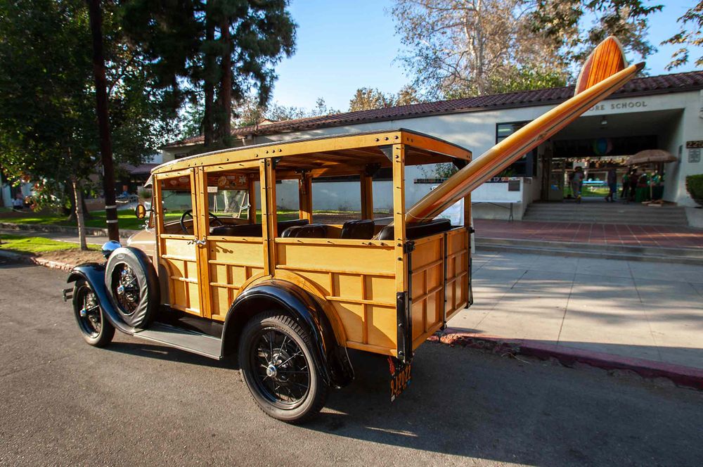 old wooden car and wooden sire board  in  Pomona California
