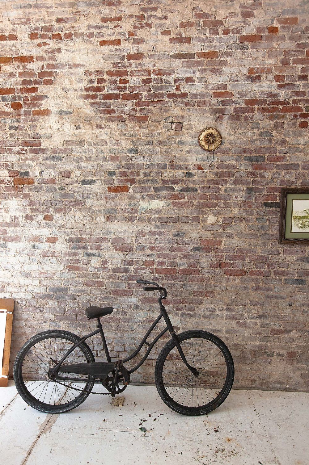 old bycycle  by brick wall in Apalachicola Flordia 
