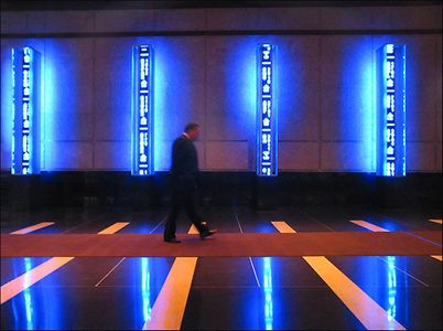 1Man_walking_lobby_blue_lights