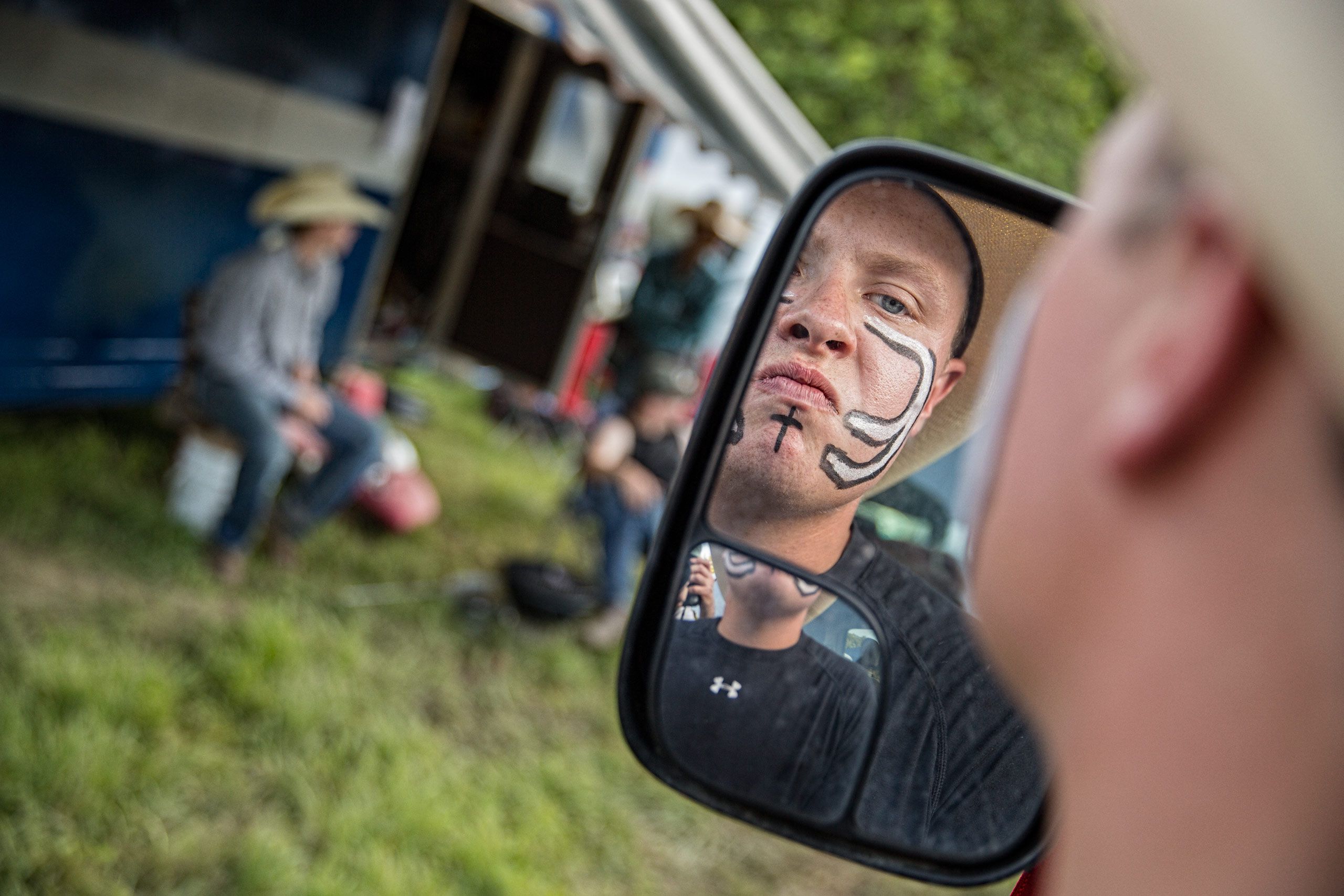 Boy Preparing For  Rodeo Applying Face Paint
