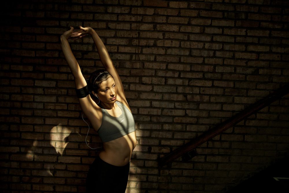 Lou Bopp Lifestyle photography woman stretching Nike wardrobe Lou-Bopp-Lifestyle-photography-woman-stretching-Nike-wardrobe