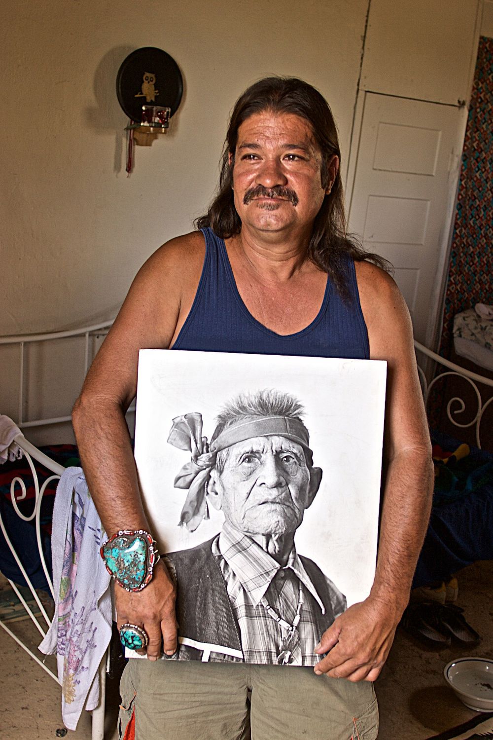 Native American Man Holding a Photograph