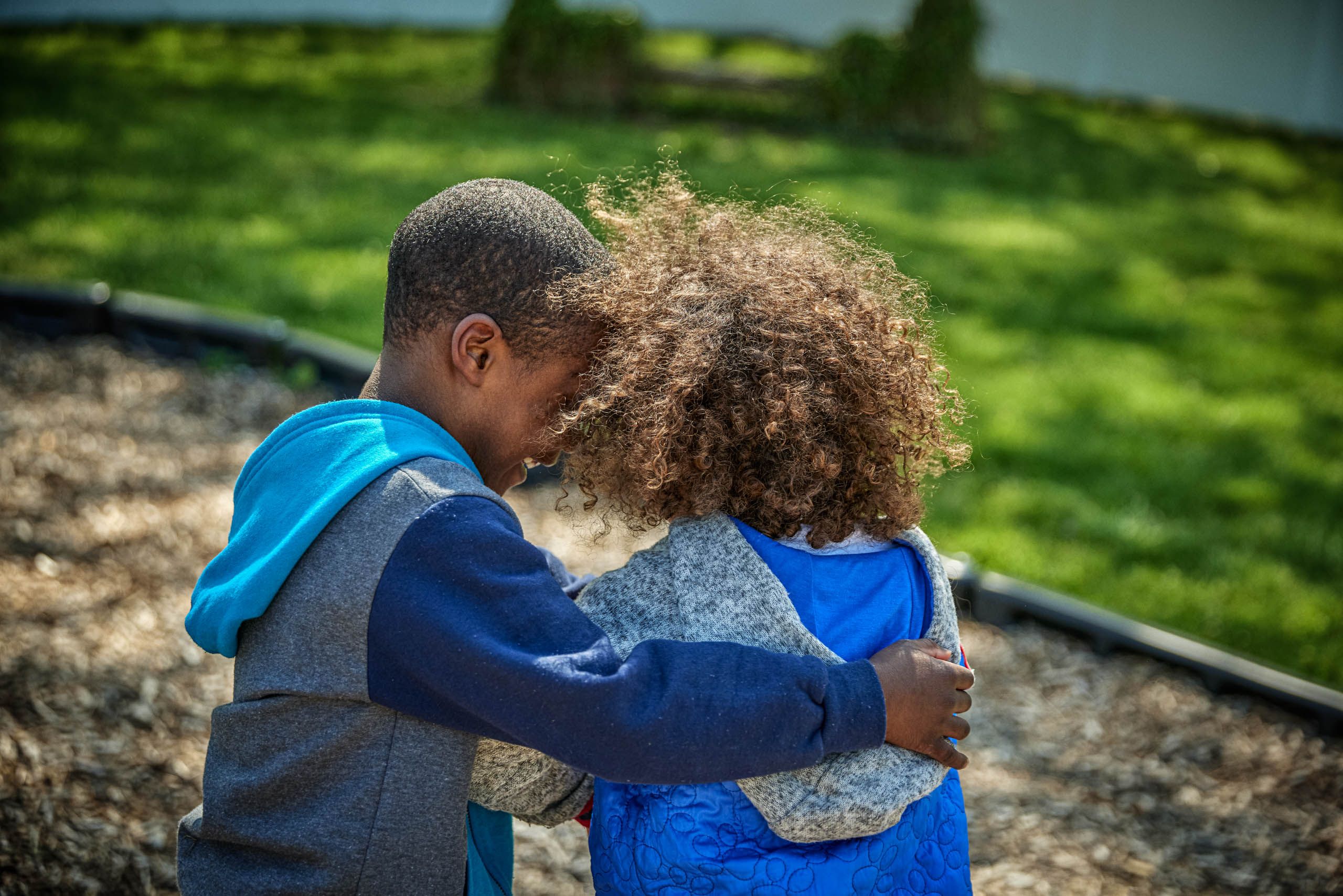 Boy and Girl Hugging at the Park