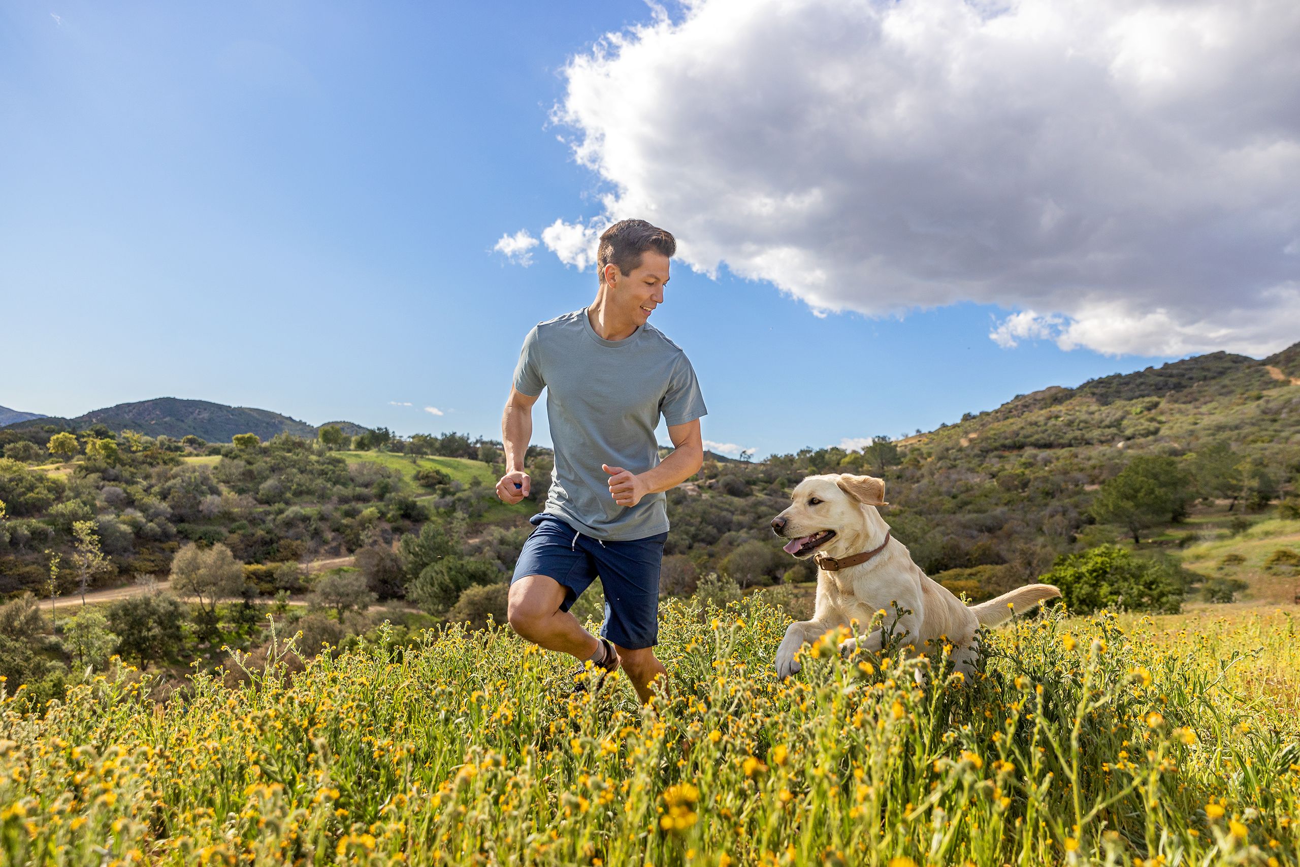 Running in Field with Dog