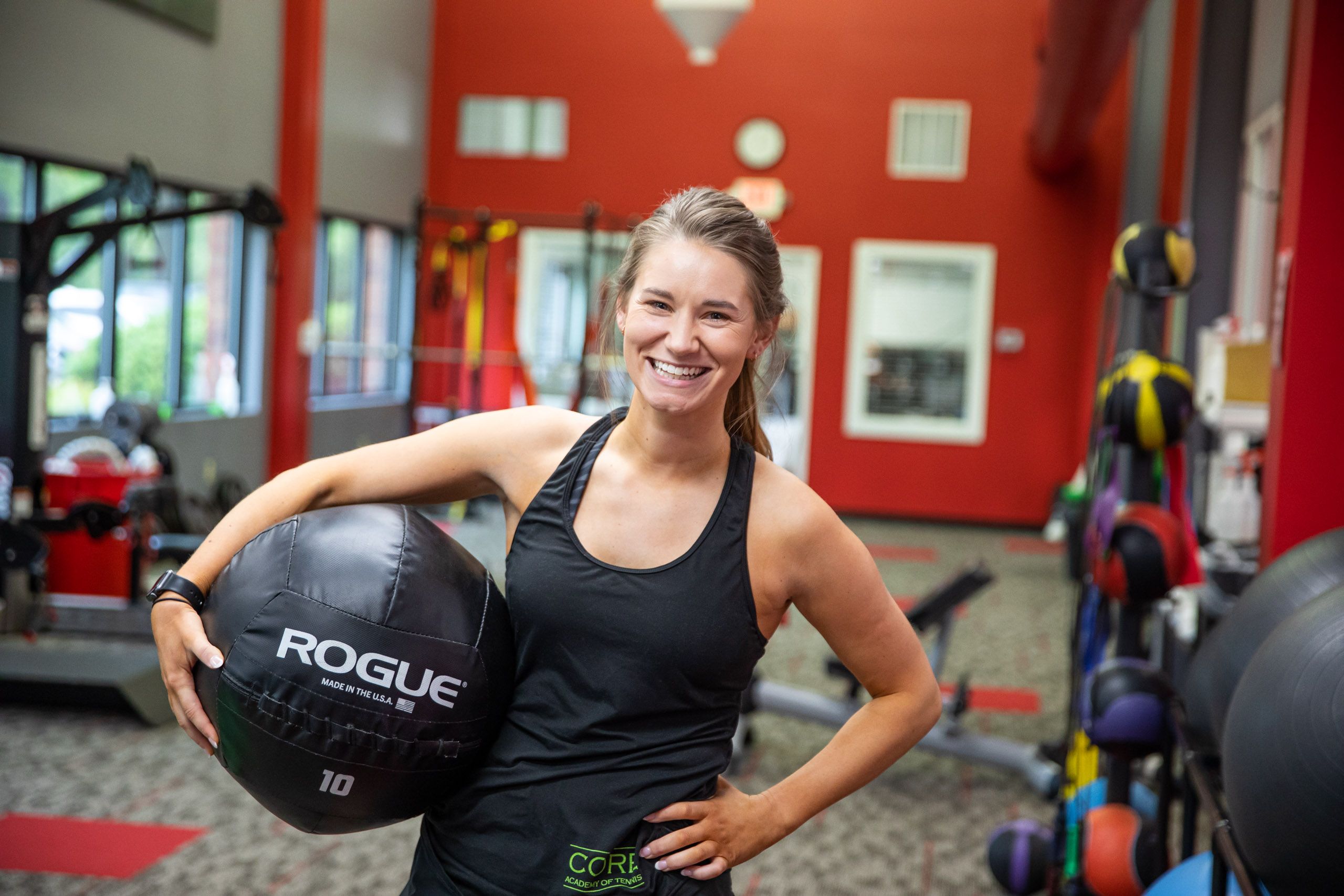 Woman Smiling with Medicine Ball