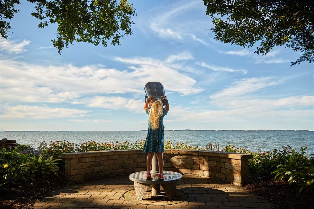 Girl Gazing Through Binoculars