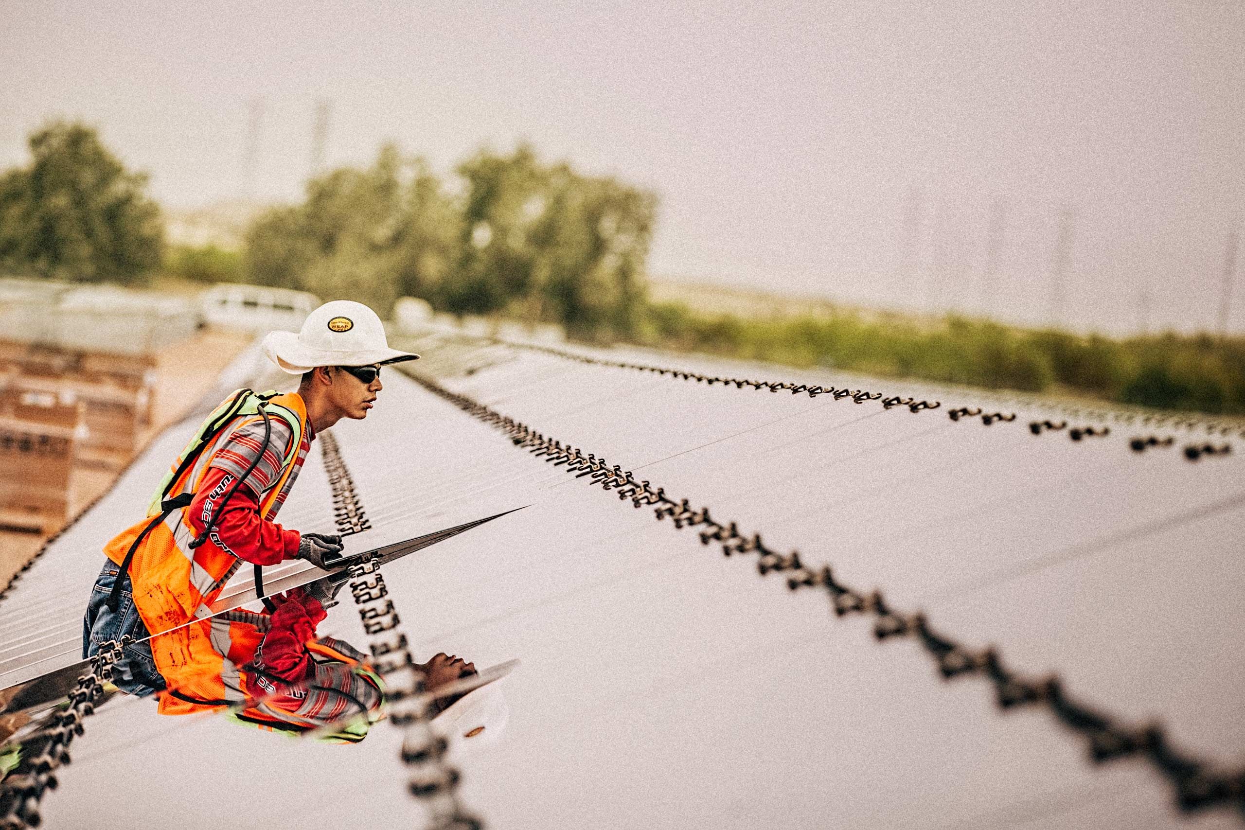 Worker Installing a Solar Panel