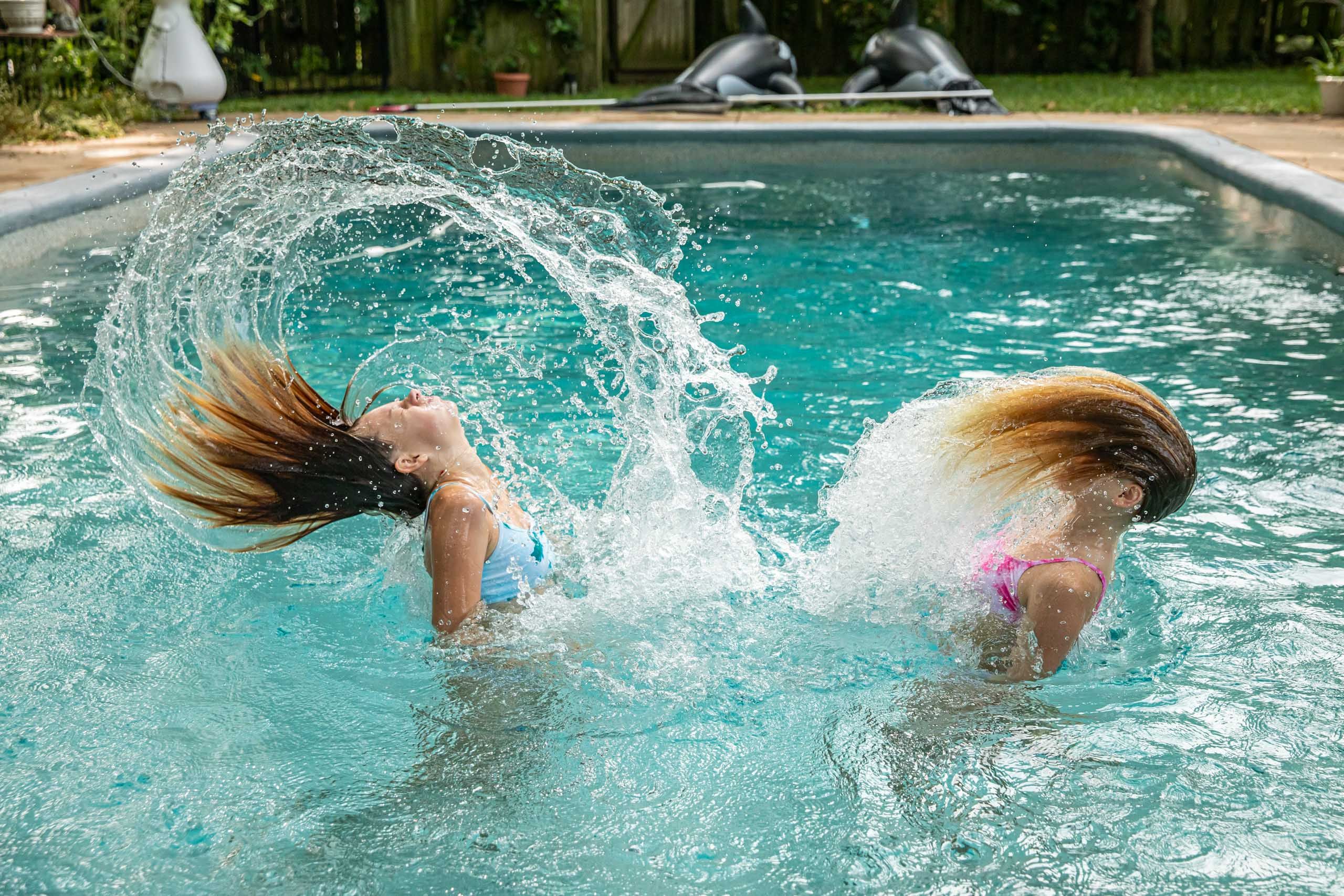 Girls Flip Their Hair in Pool