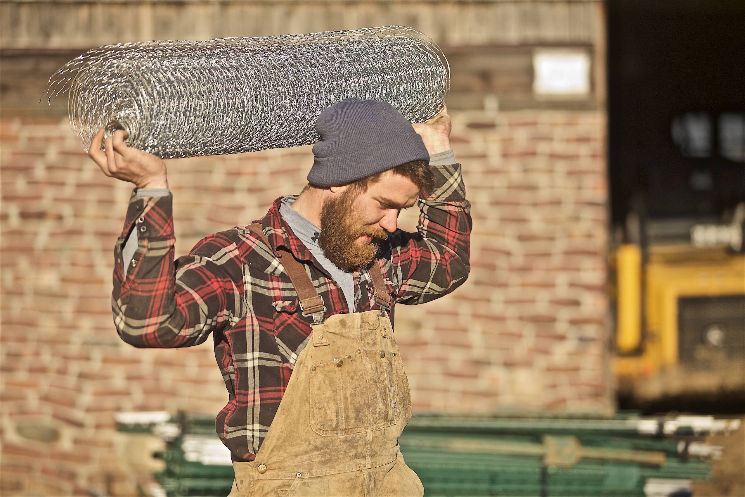 Farmer Carrying Chicken Wire