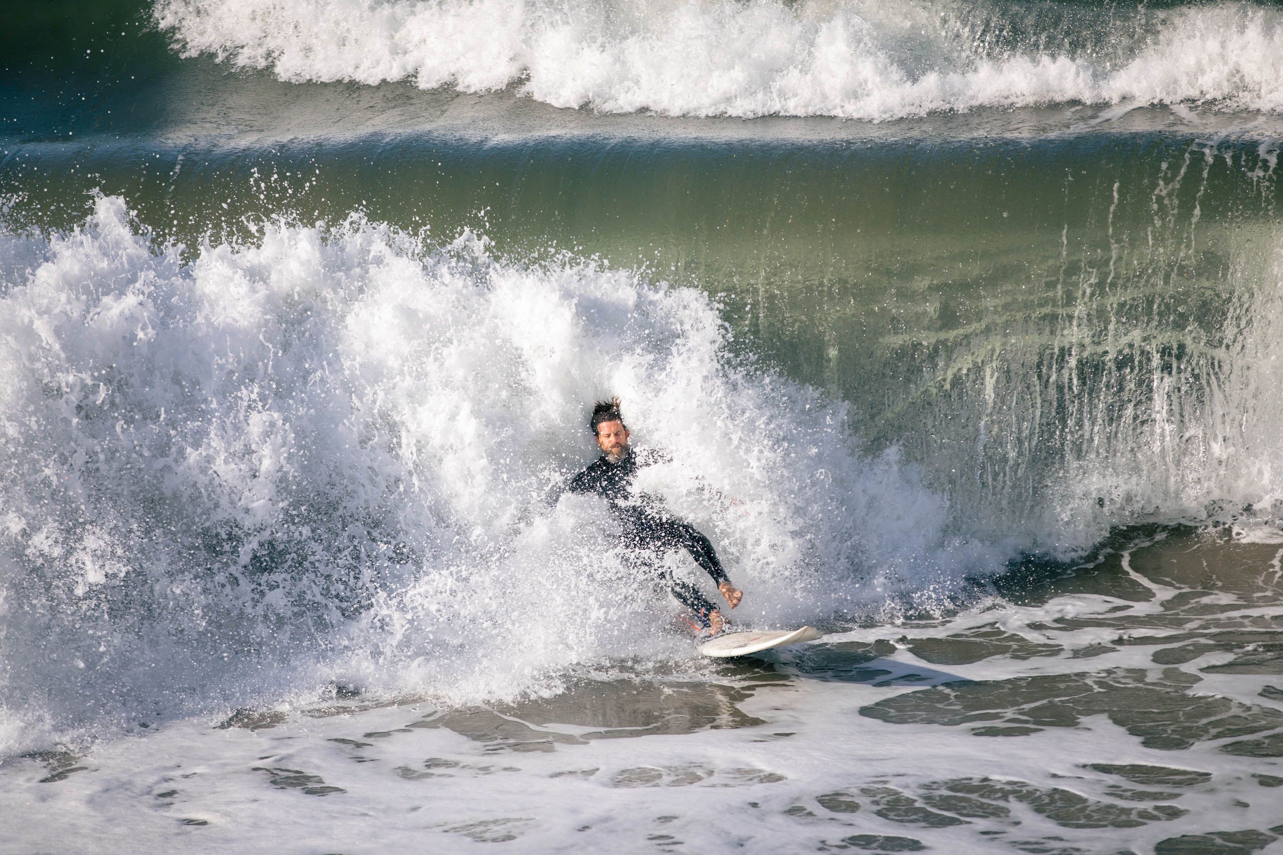 Man Surfing in Crashing Wave