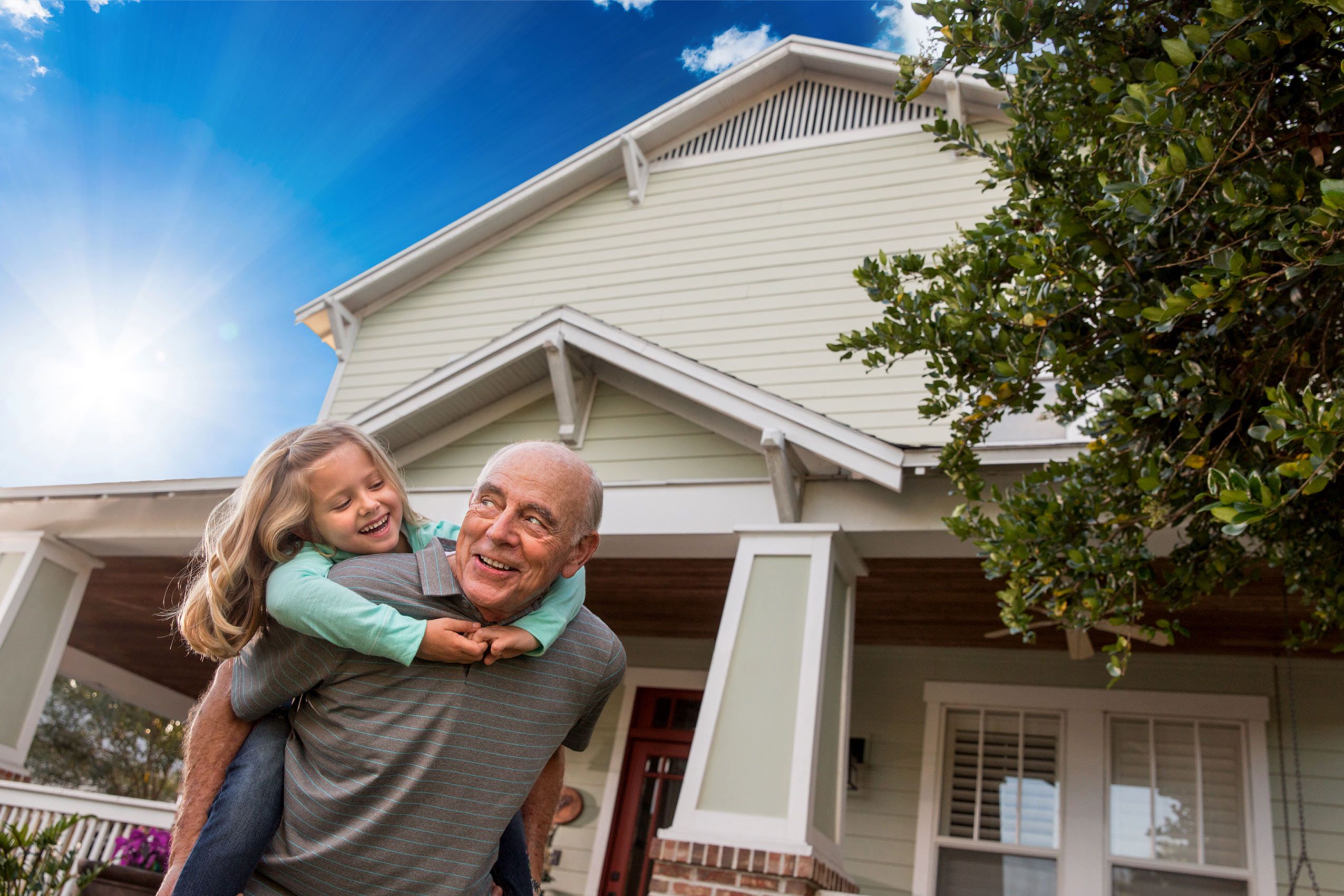 Grandfather Giving His Granddaughter a Piggyback Ride