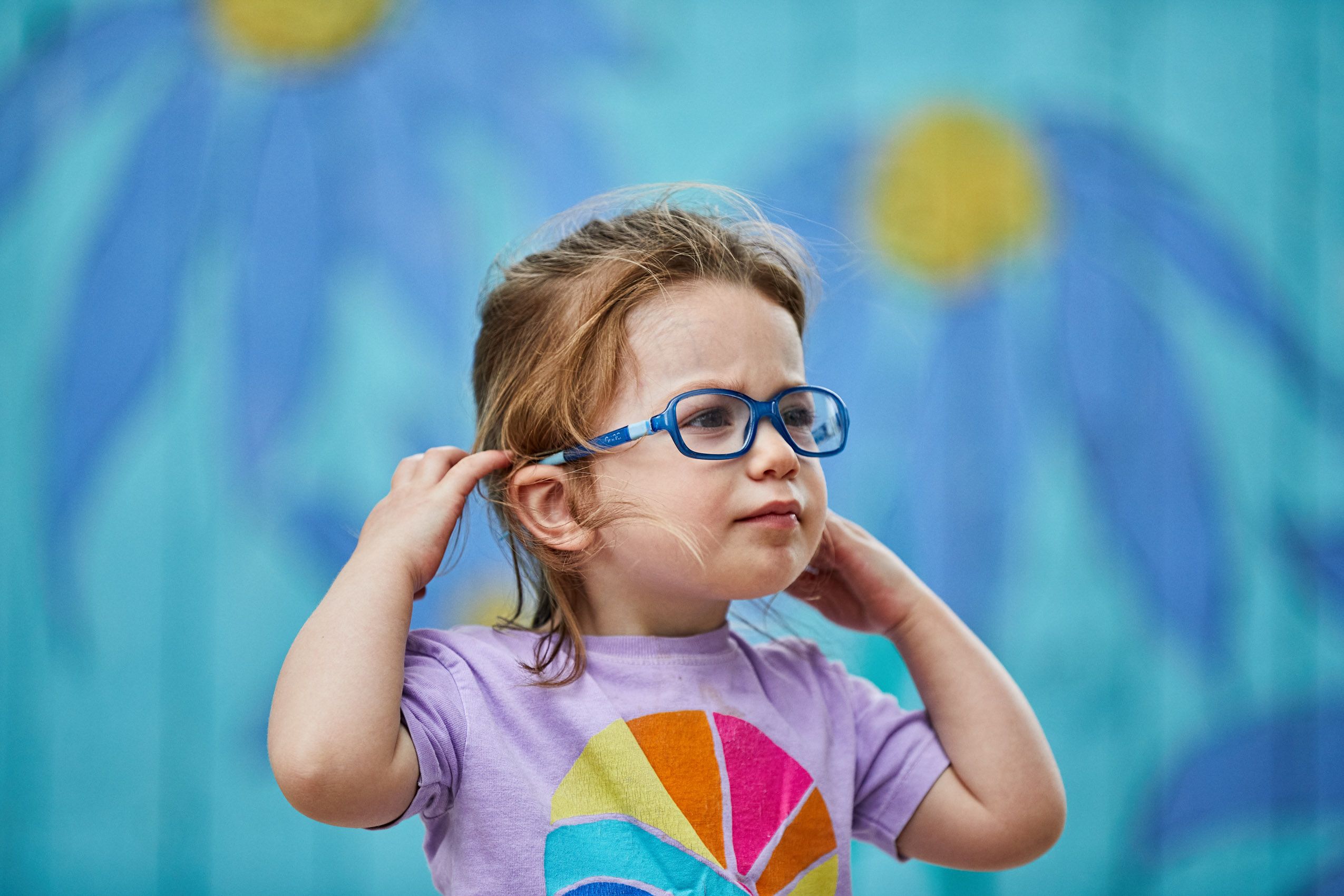 Young Girl with Glasses Looking Away