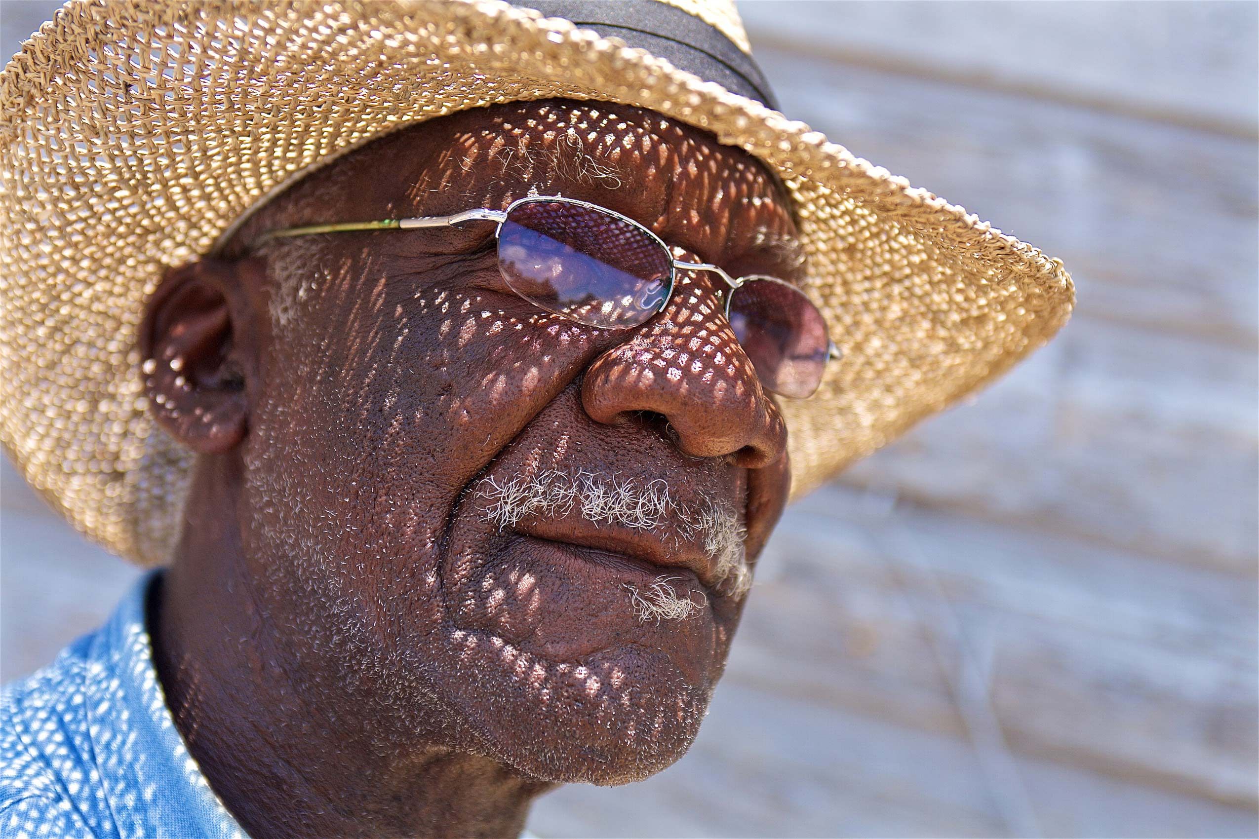 Photo of a Man in a Straw Hat