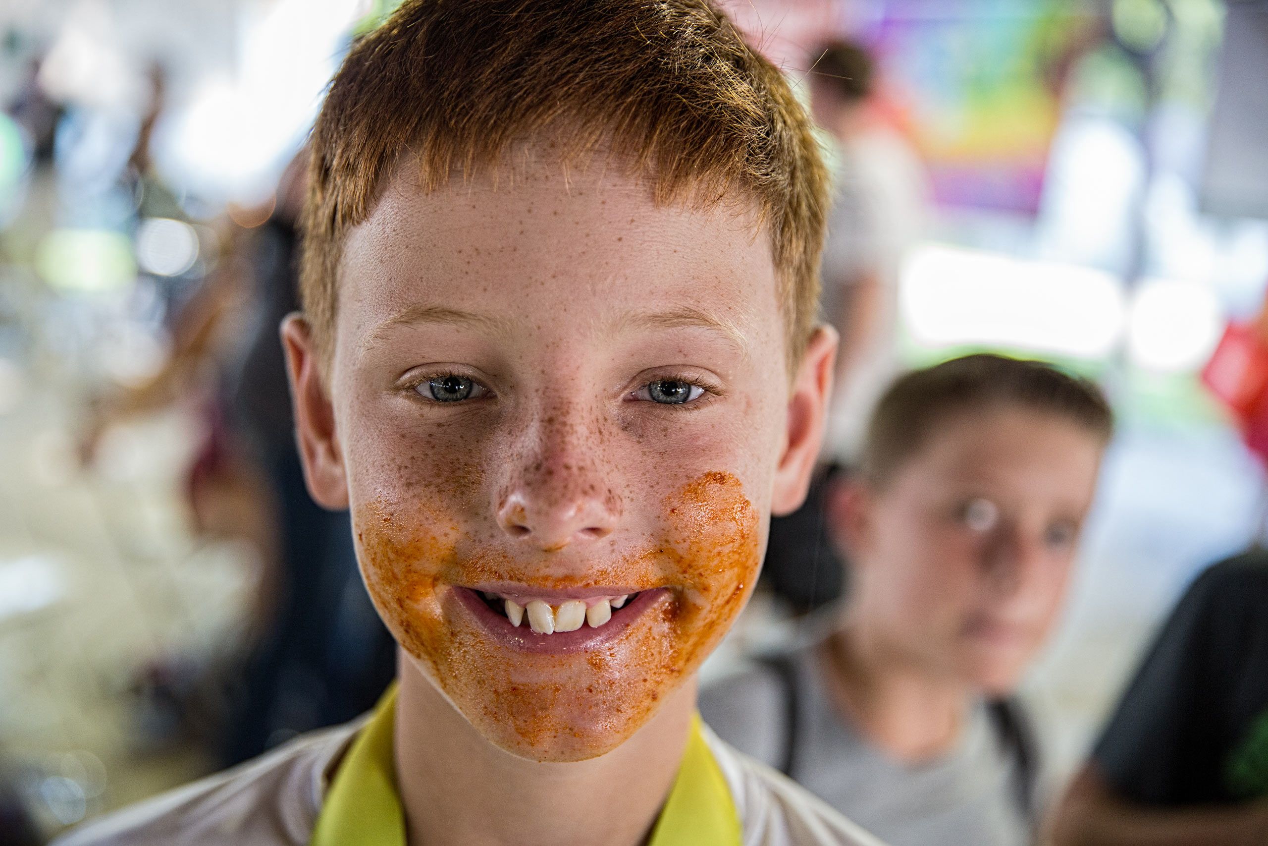Boy With Chicken Wing Sauce On His Face After Eating Contest