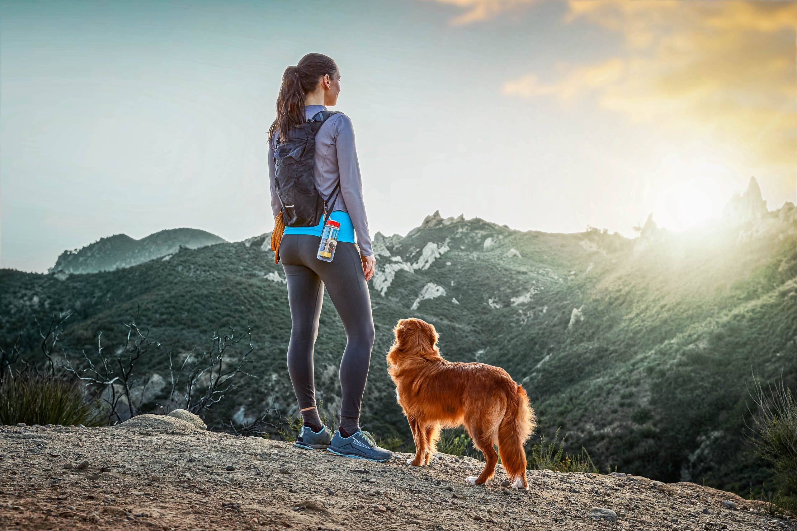 Woman and Dog Admire View on Hike