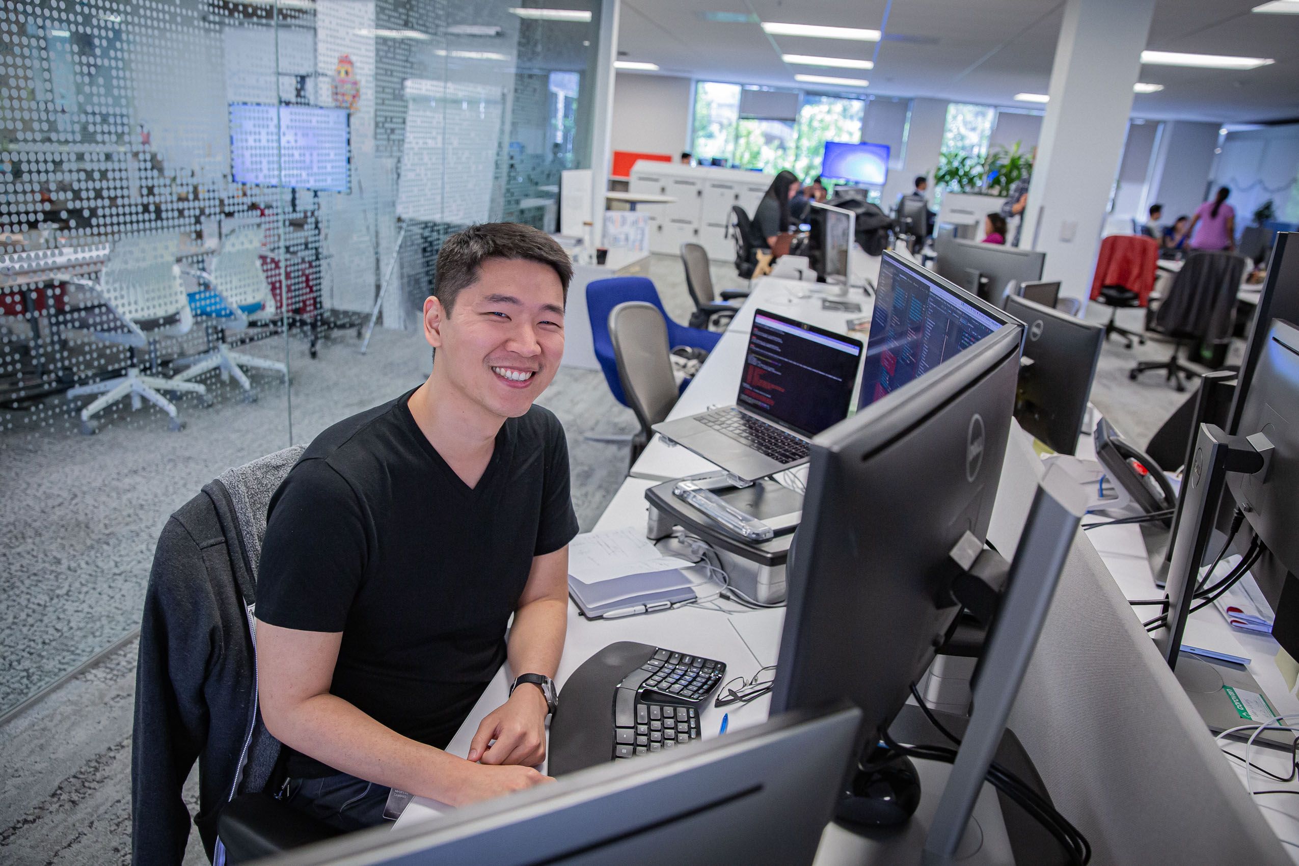 Man Smiling at Office Desk