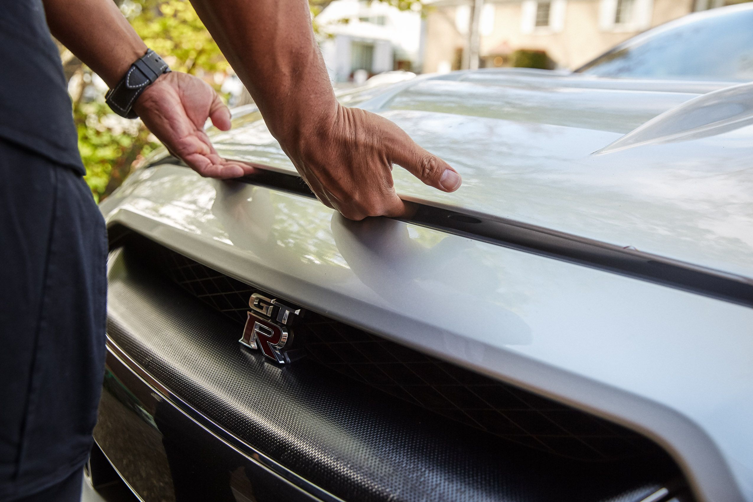 Man Opens Car Hood