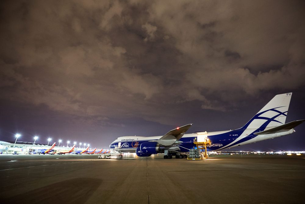Wide side view of a Boeing 747-8 Freighter at an airport, with the left side cargo door open, being unloaded and then being re loaded with cargo at night time. Next stop, the other side of the world! A project shooting for the air cargo industry. This project was amazing as an industrial photographer, on location photographer & location commercial photographer.
Shallow depth of field and selective focus. Environmental portraits Wide Side View of a 747 Cargo Plane