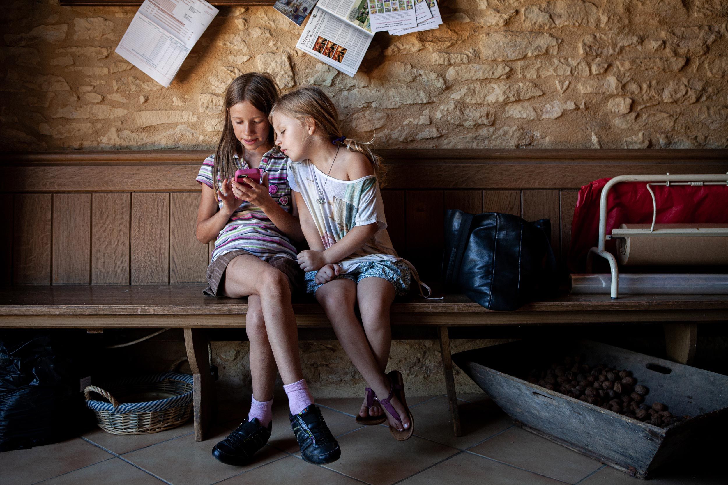 Young Girls Looking at a Phone