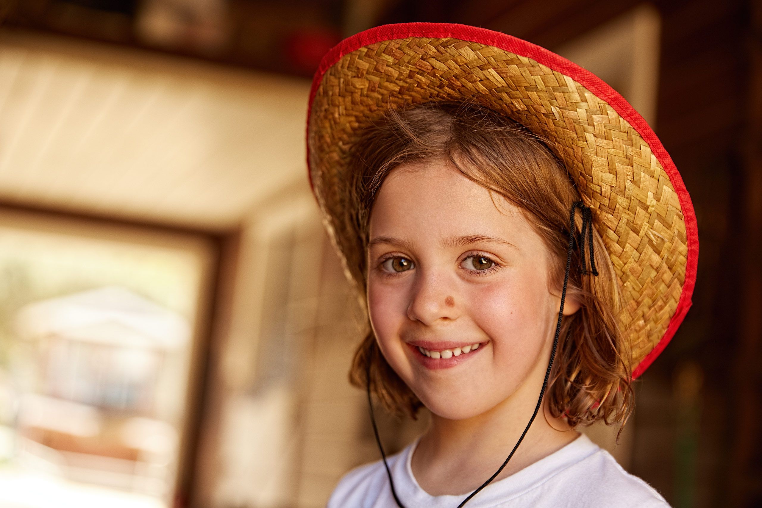 Girl Smiling With Cowboy Hat