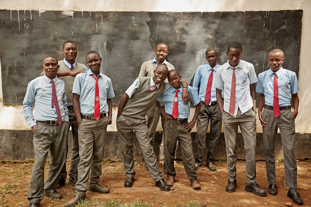 An all male group of friends standing looking into the camera at school. GroupofKidsatSchool.jpg