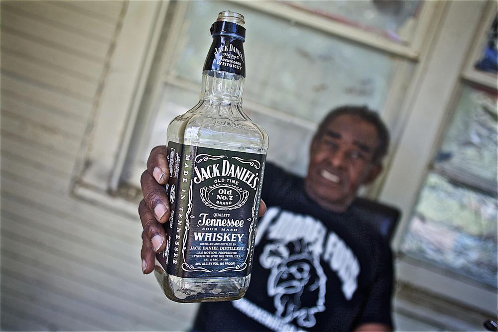 T Model Ford Holding a Bottle of Jack Daniels