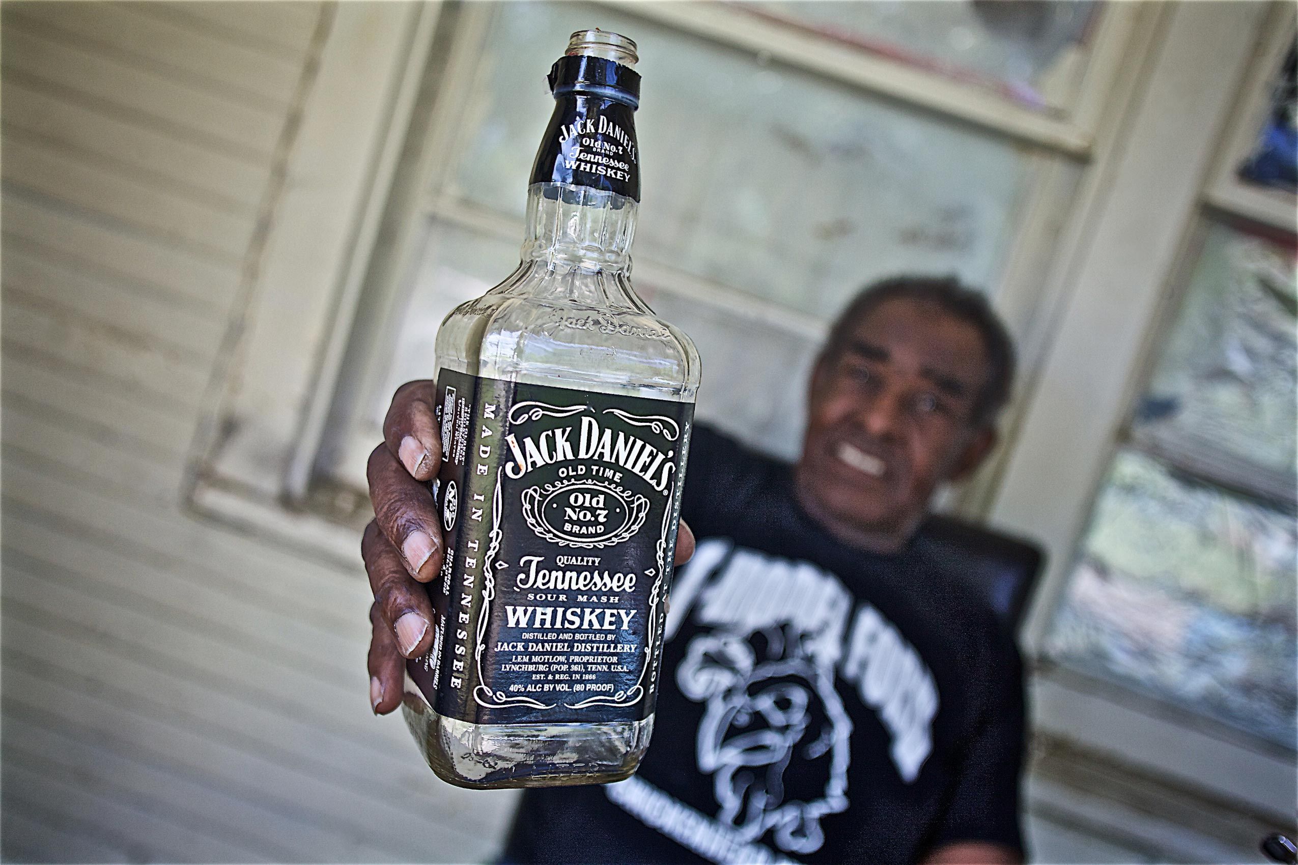 T Model Ford Holding a Bottle of Jack Daniels