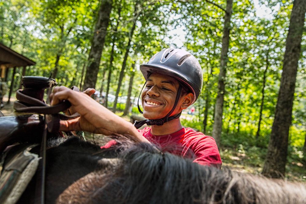 Boy Getting Ready to Ride a Horse