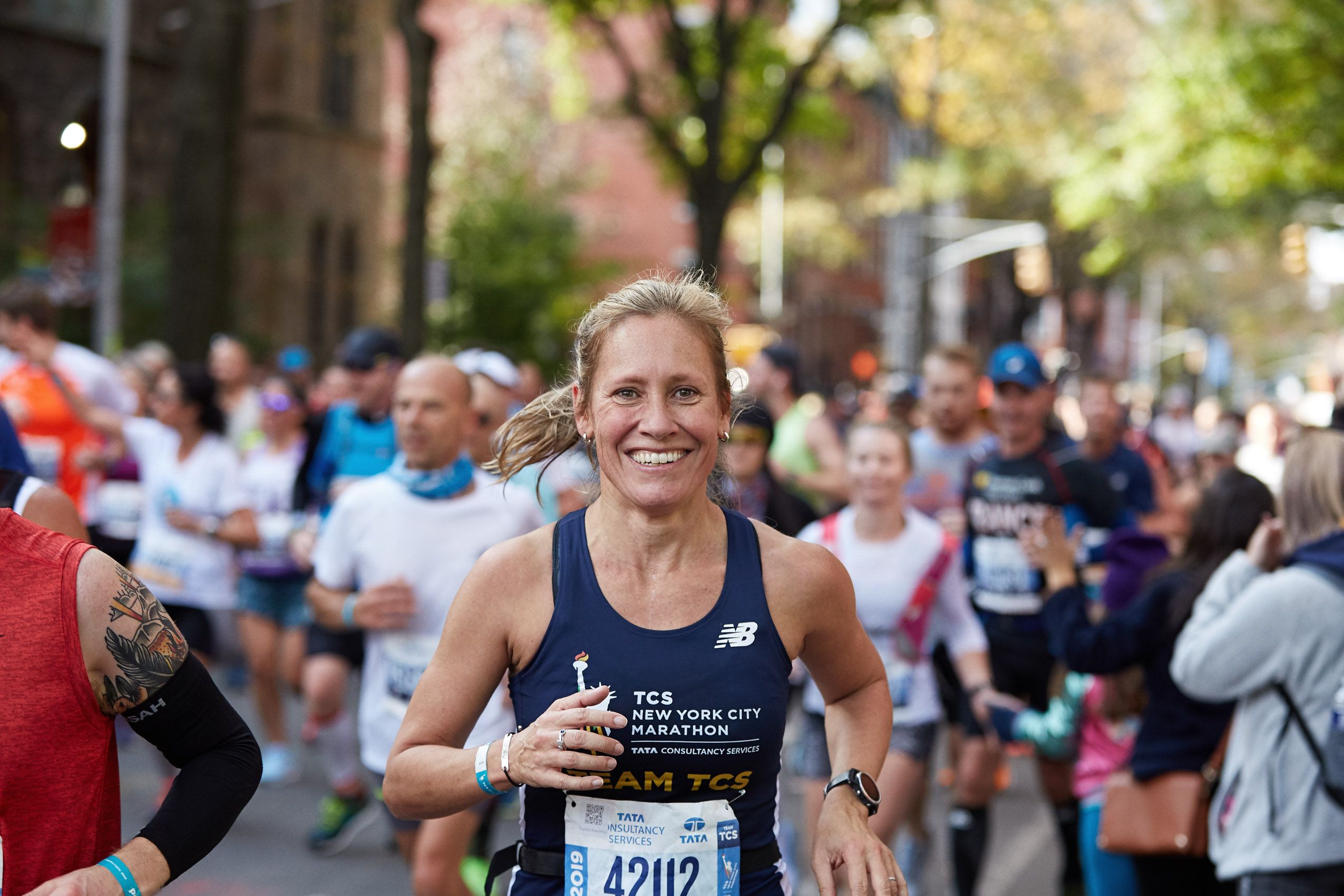 Woman Smiling Running NYC Marathon