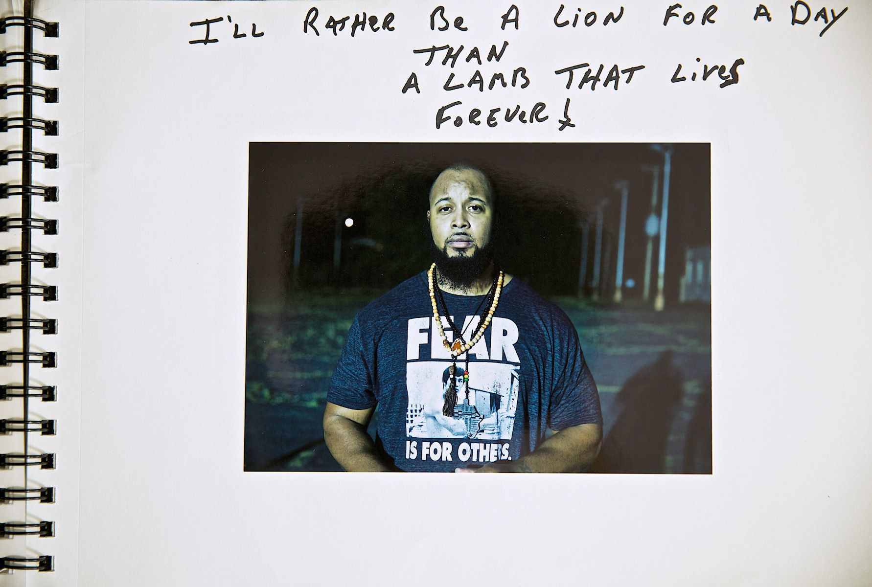 Man at Night With Fear on His Shirt