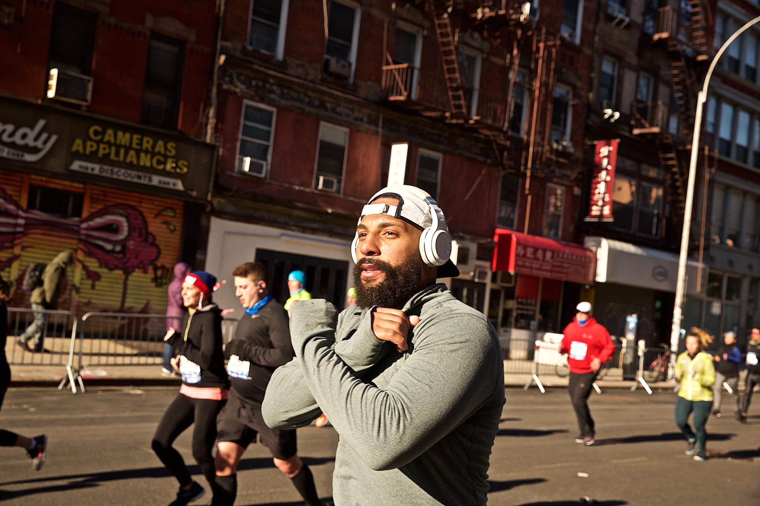 Man Running With Arms Crossed