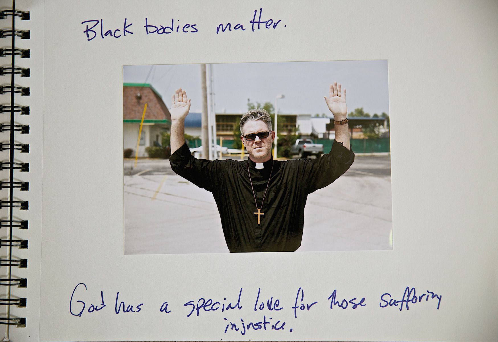 Priest With Hands Up