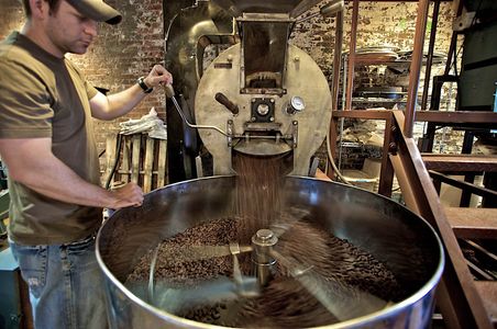 A photo of Askinosie Chocolate Cocoa being roasted in Springfield, MO, with shallow depth of field and selective focus. Askinosie Chocolate Cocoa Roaster