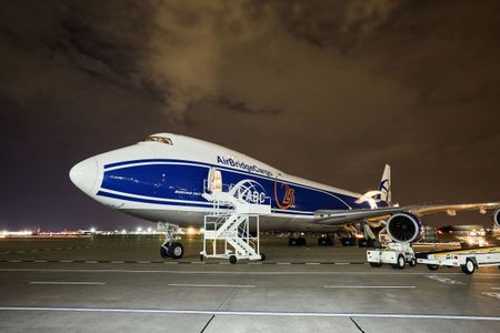 Wide front side view of a Boeing 747-8 Freighter nose cone & cockpit, at an airport, with the left side cargo door open, being unloaded and then being re loaded with cargo at night time. Next stop, the other side of the world! A project shooting for the air cargo industry. This project was amazing as an industrial photographer, on location photographer & location commercial photographer.
Shallow depth of field and selective focus. Environmental portraits Nose of a Boeing 747 Airplane