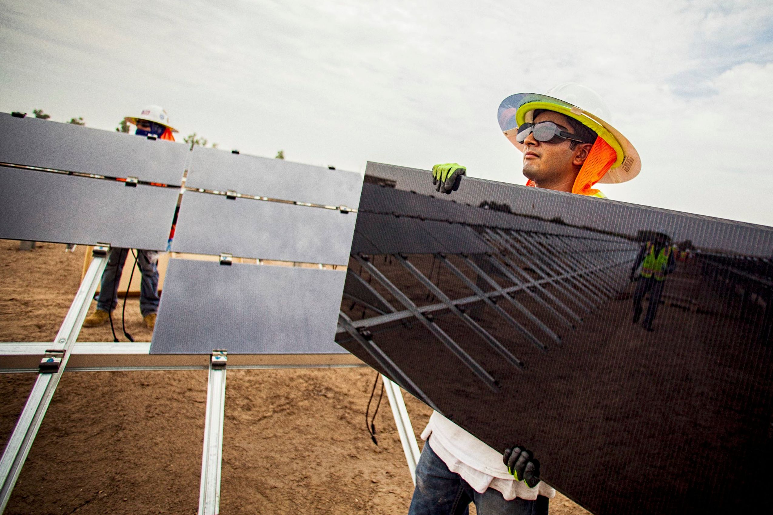 Worker Holding a Solar Panel).jpg